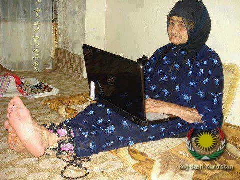 Kurdish grandmother using laptop